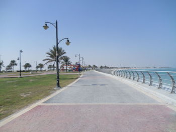 Street by road against clear sky