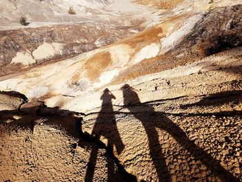 Shadow of people on rock