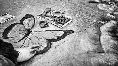 High angle view of man painting on wall