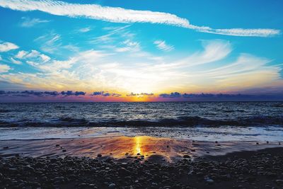 Scenic view of sea against dramatic sky