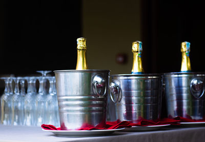Close-up of wine glasses on table