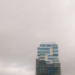 Low angle view of modern building against sky