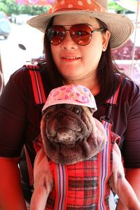Portrait of smiling woman wearing hat