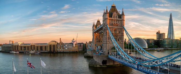 View of bridge over river against cloudy sky