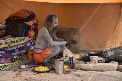 Woman sitting at market stall