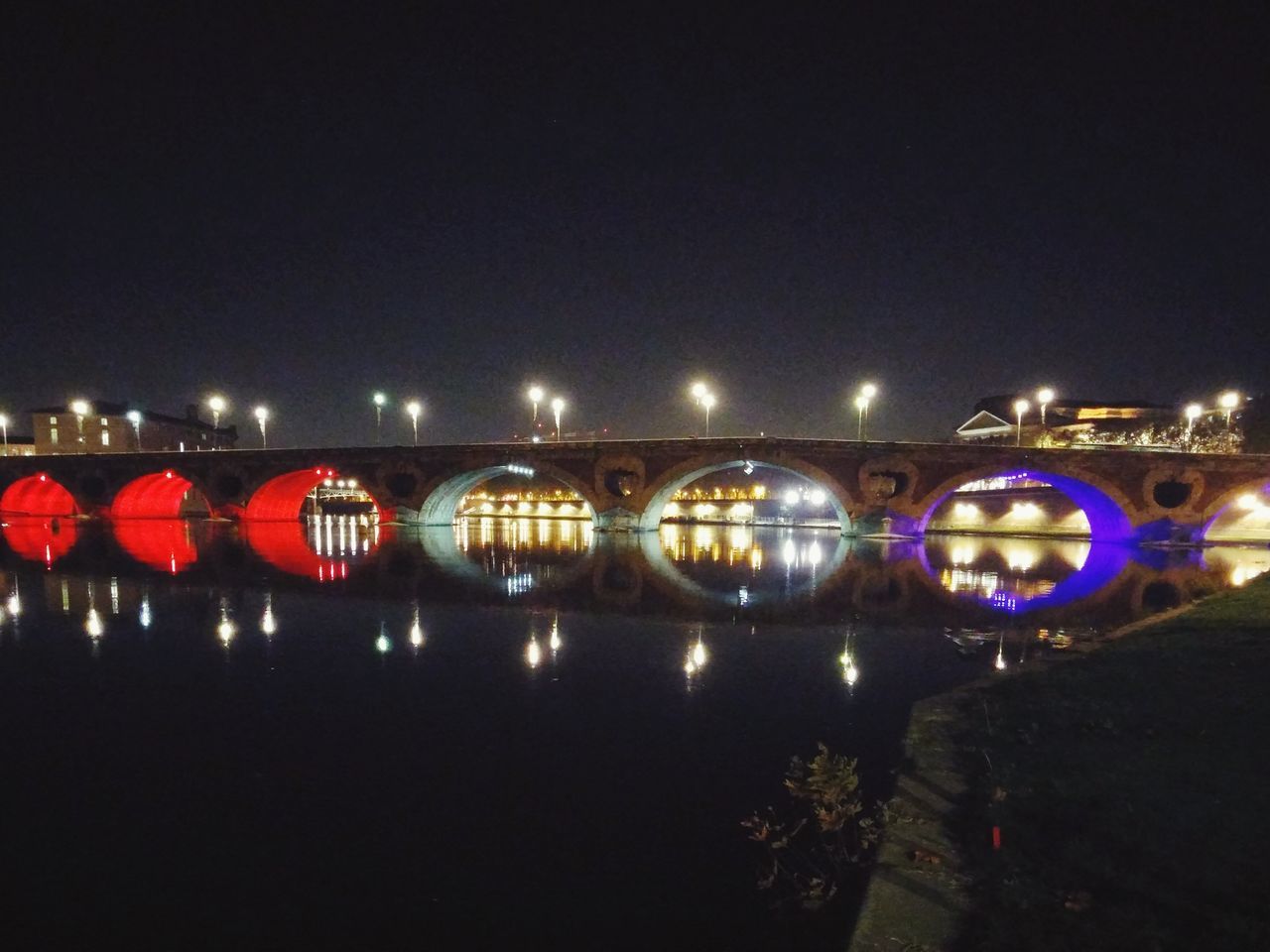 illuminated, night, connection, bridge - man made structure, built structure, architecture, bridge, water, river, clear sky, reflection, transportation, engineering, copy space, lighting equipment, arch bridge, arch, street light, dark, outdoors