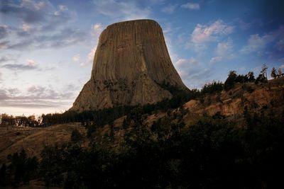 Low angle view of rock formations against sky