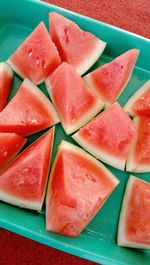 High angle view of chopped fruits in plate on table