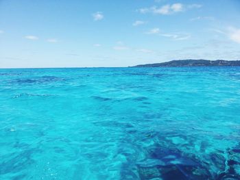 Scenic view of sea against blue sky