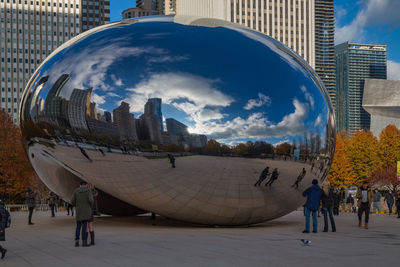 Panoramic view of city against cloudy sky