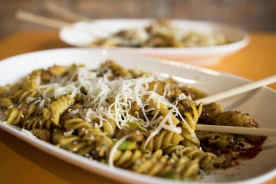 Close-up of pasta in plates on table