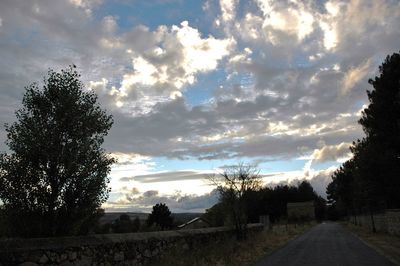 Scenic view of field against cloudy sky