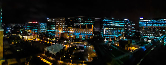 High angle view of city lit up at night