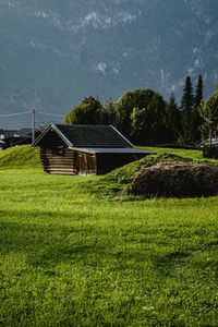 House on field against sky