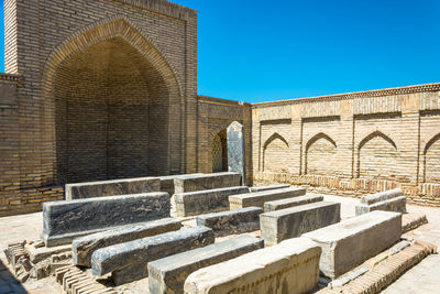 Burial in the necropolis of chor-bakr, summer sunny day, bukhara, uzbekistan.