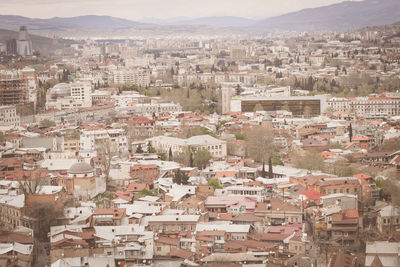 Aerial view of townscape against sky