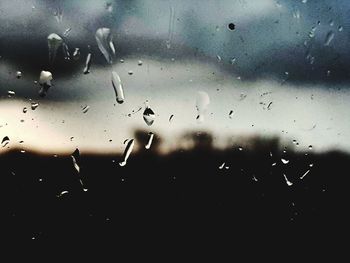 Close-up of raindrops on glass window