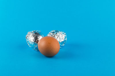 High angle view of eggs against blue background