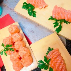 High angle view of sushi served on cutting board