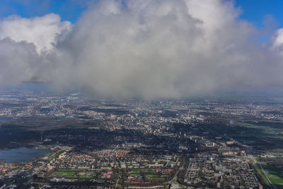 Aerial view of cityscape against sky