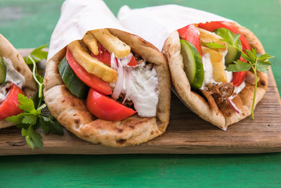 Doner kebap, taco, shawarma, greek wrapped gyros sandwich, tortilla pita bread stuffed 