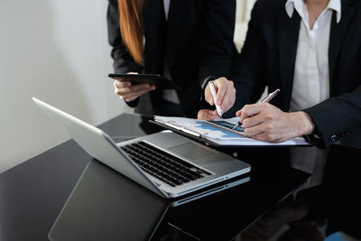 People using laptop on table