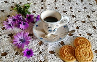 High angle view of biscuits and tea on table