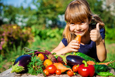 Portrait of girl with fresh bowl of vegetables