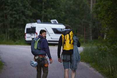 Rock climbers walking towards van