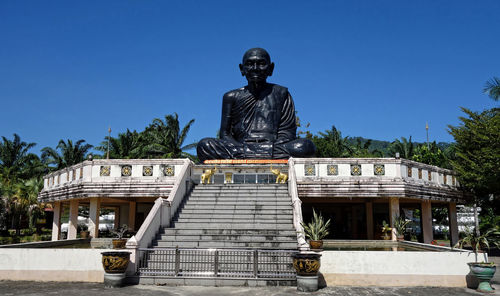 Statue against clear blue sky
