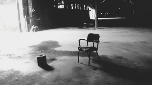 Empty chair in abandoned building