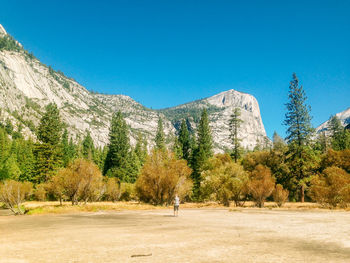 Scenic view of mountains against clear blue sky