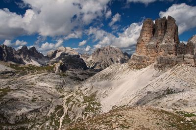 Scenic view of torre di toblin mountains against cloudy sky