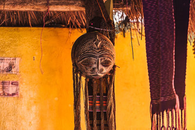 Clothes hanging against wall in building