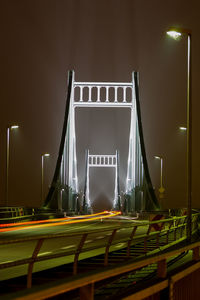 Illuminated rhine bridge in krefeld-uerdingen, germany at night