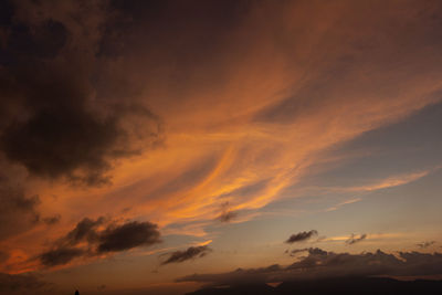 Low angle view of dramatic sky during sunset