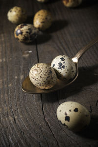 Quail eggs on a wooden table.