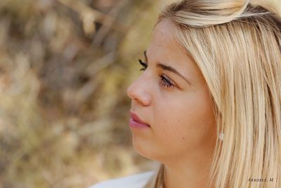 Close-up of young woman looking away
