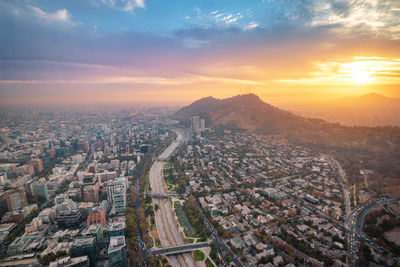 Aerial view of townscape against sky during sunset