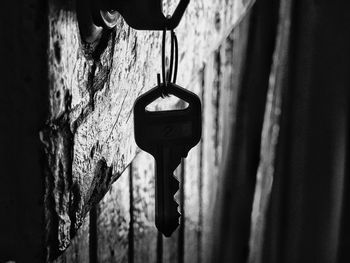 Close-up of metal hanging against wall