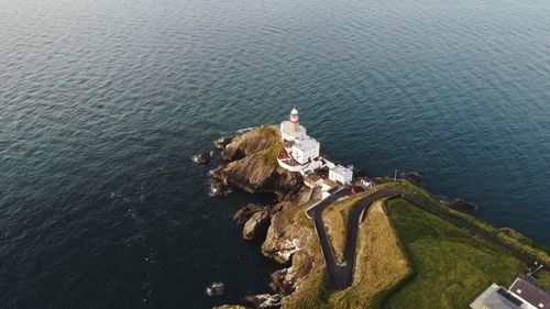 High angle view of lighthouse in sea