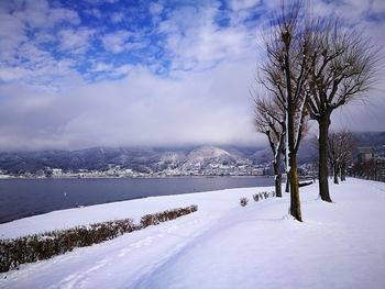 Scenic view of snow covered mountains against sky