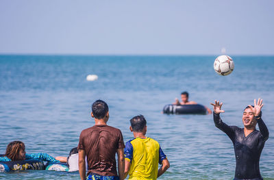 Woman jumping in sea