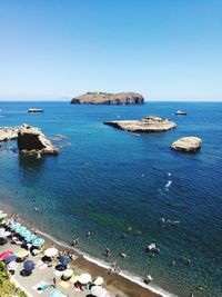 Scenic view of sea against clear blue sky