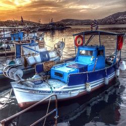 Boats moored at harbor