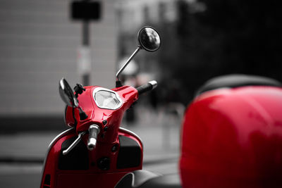 Close-up of red motor scooter