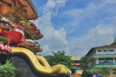 Low angle view of statue against sky