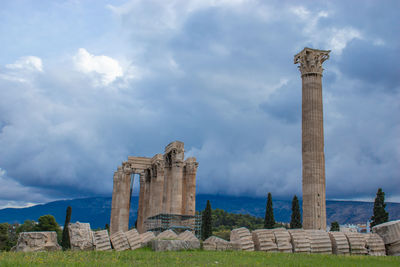 Old ruins of temple against cloudy sky