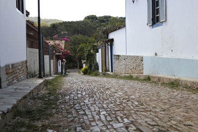 Narrow walkway leading to alley