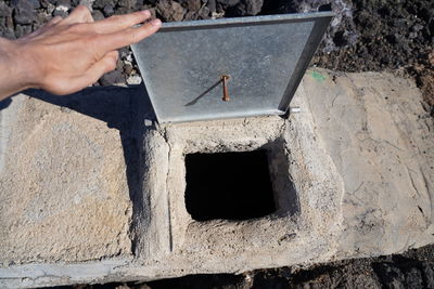 High angle view of hand holding built structure